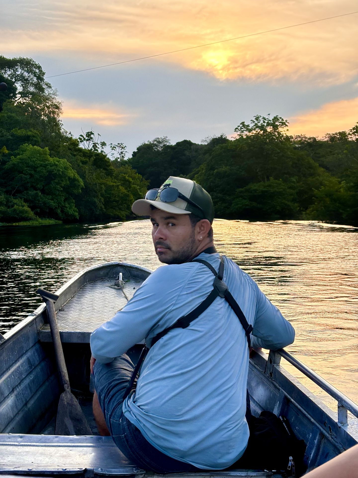 Edson Roberto, founder of Amazon Eco Travellers, on the river at sunset