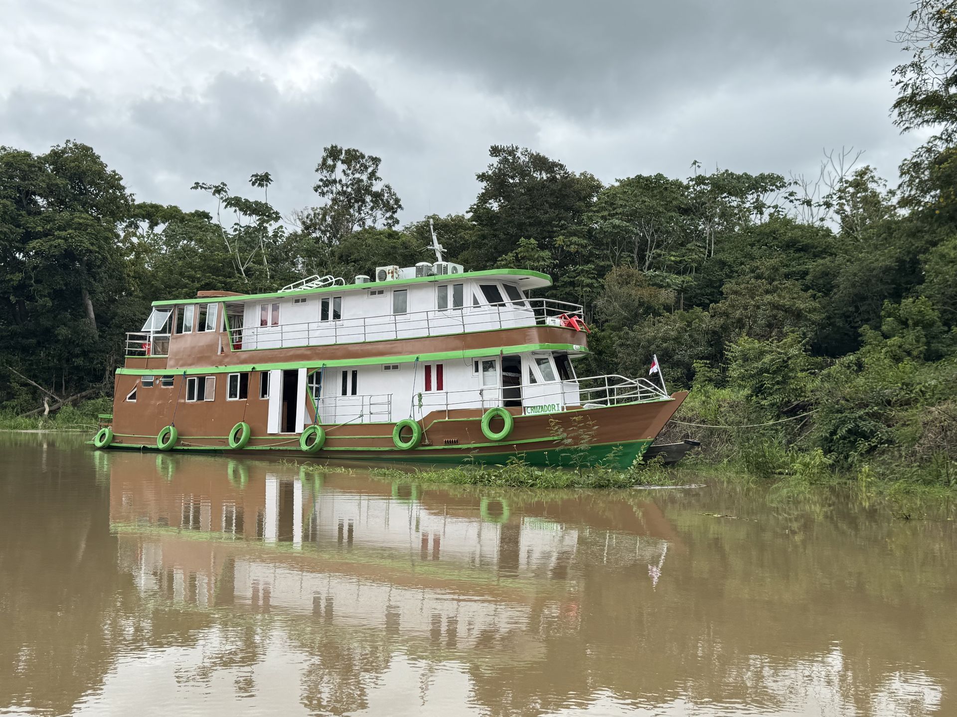Amazon riverboat anchored in a jungle river — Rio Negro
