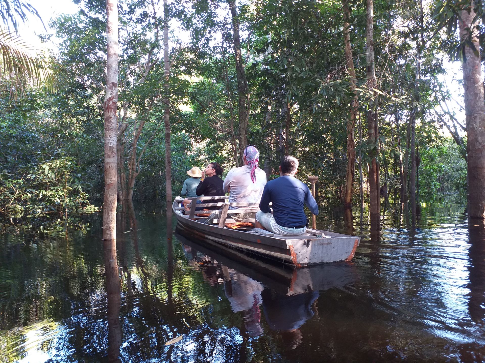 Canoe navigating the flooded igapó forest on the Rio Negro during the Amazon expedition