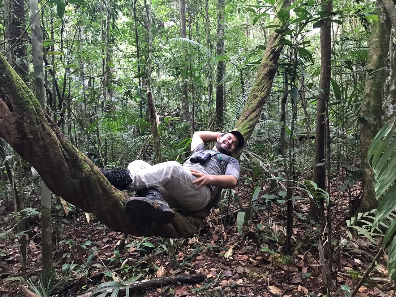 Guide resting in the Amazon jungle during a deep forest trek — authentic Amazon experience